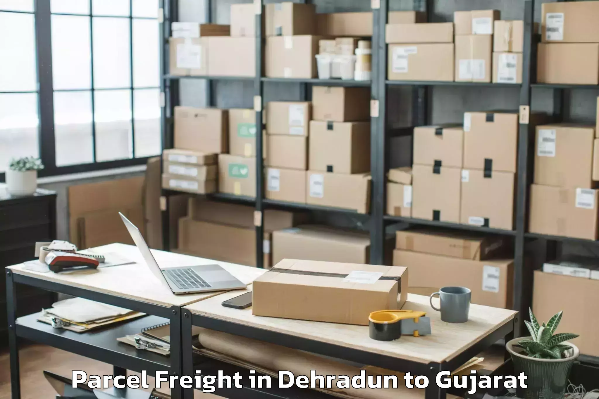 Top Dehradun to Khambhaliya Parcel Freight Available